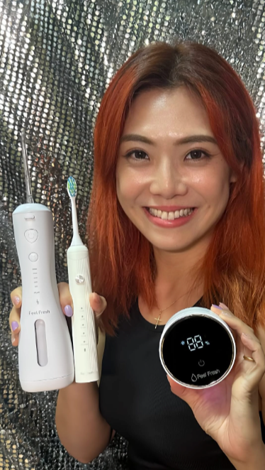 Content creator showcasing portable AquaJet Mini water flosser during vacation